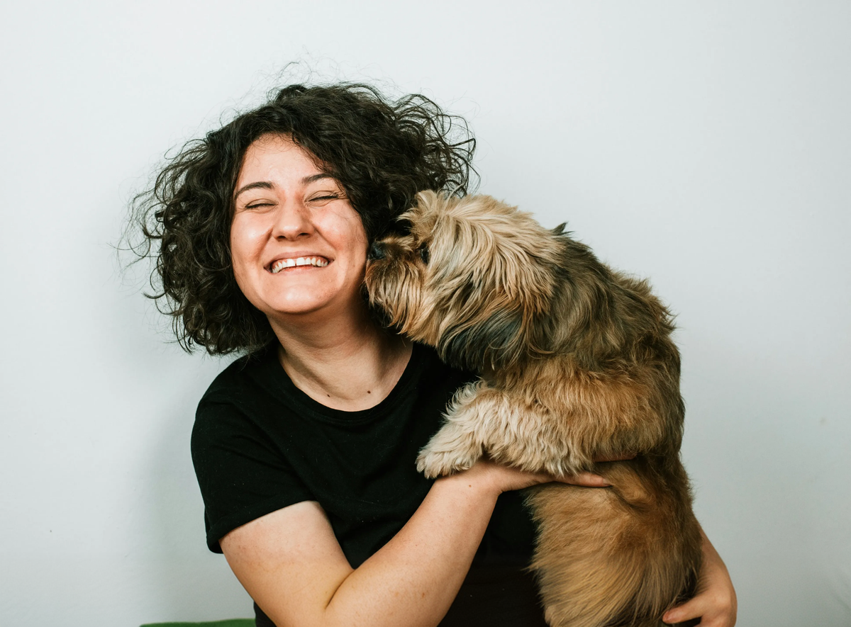 Happy pet parent with their pet